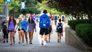 Groups of students walking through campus.