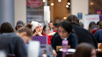A group of students study in the atrium of the Gatton College of Business and Economics