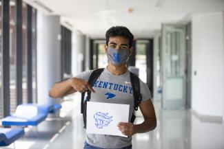 Student with Wildcat drawing