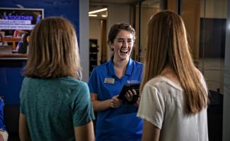 Tour guide checking in students