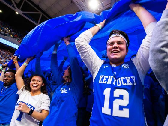 Students cheering at a basketball game